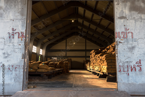 Full hessian sacks in a warehouse.