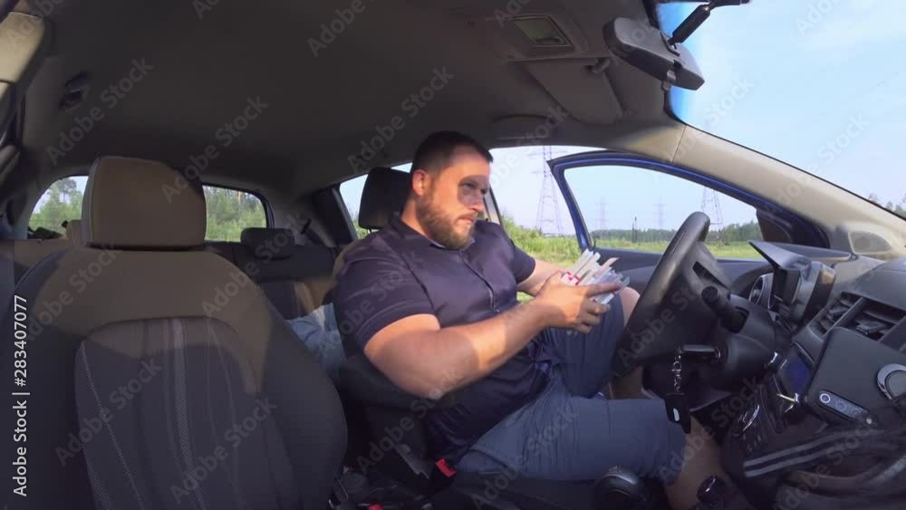 Robbers prepare for a robbery in a car, load weapons and put on masks. Robbers prepare for a robbery in a car, load weapons and put on masks.