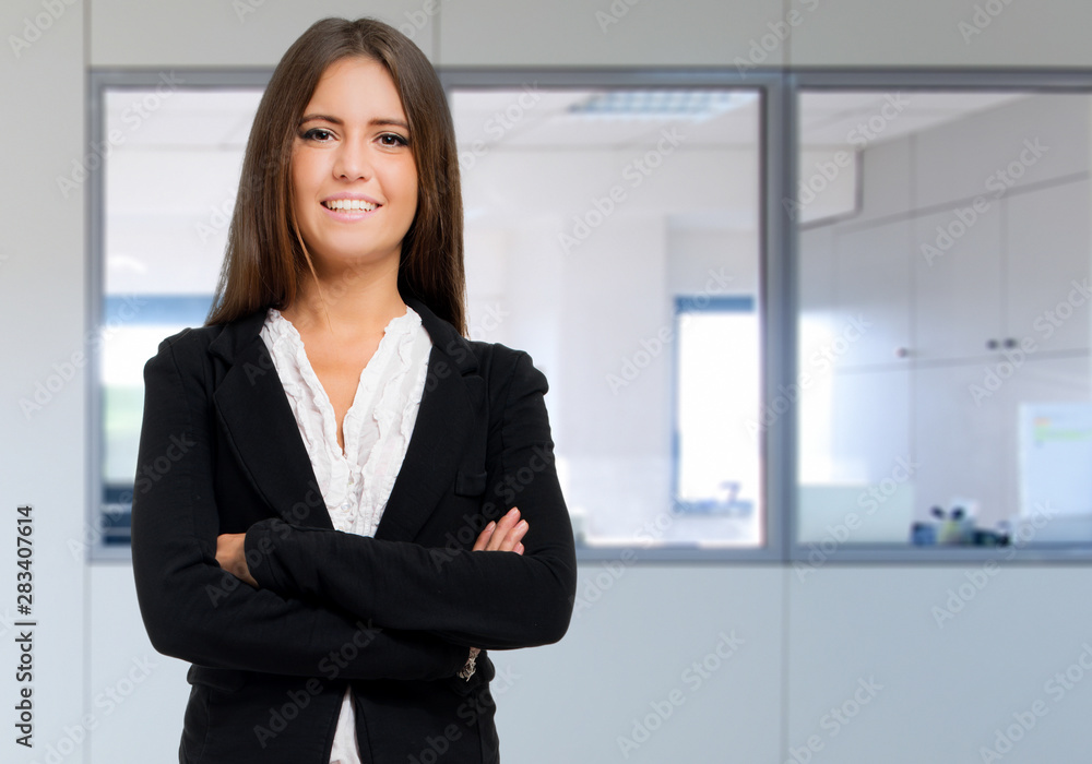 Smiling businesswoman portrait in her office Smiling businesswoman portrait in her office