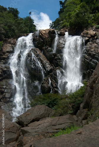 beautiful waterfalls with trees and sky