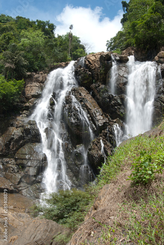 beautiful waterfalls with trees and sky