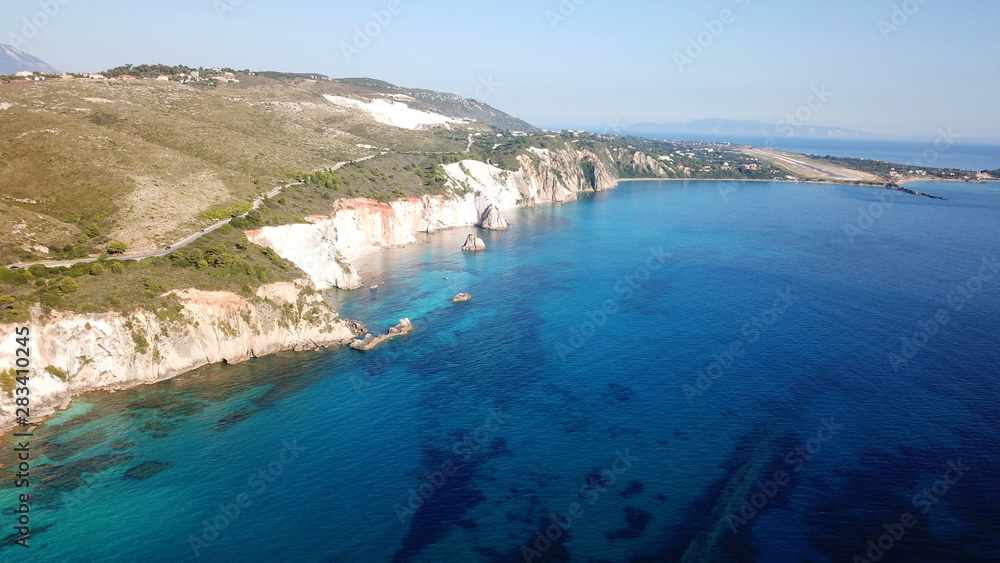 Aerial drone photo of iconic white rock cliffs and volcanic formations near famous beach of Platys and Makrys gialos with turquoise clear sea, Argostoli, Cefalonia island, Ionian, Greece