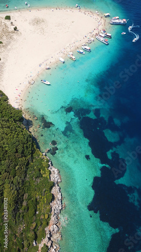 Fototapeta Naklejka Na Ścianę i Meble -  Aerial drone photo of famous white caves and sandy beach in small island of Marathonisi and beautiful turquoise seascape, Zakynthos island, Ionian, Greece