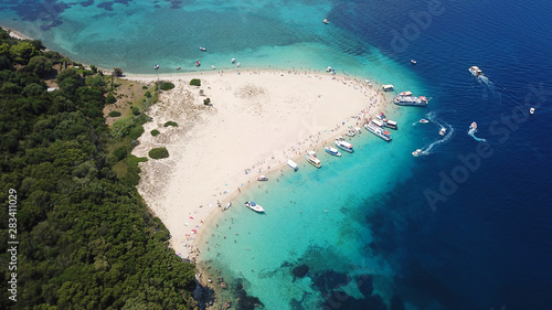 Aerial drone photo of famous white caves and sandy beach in small island of Marathonisi and beautiful turquoise seascape, Zakynthos island, Ionian, Greece