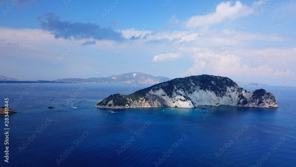 Aerial drone photo of famous white caves and sandy beach in small island of Marathonisi and beautiful turquoise seascape, Zakynthos island, Ionian, Greece