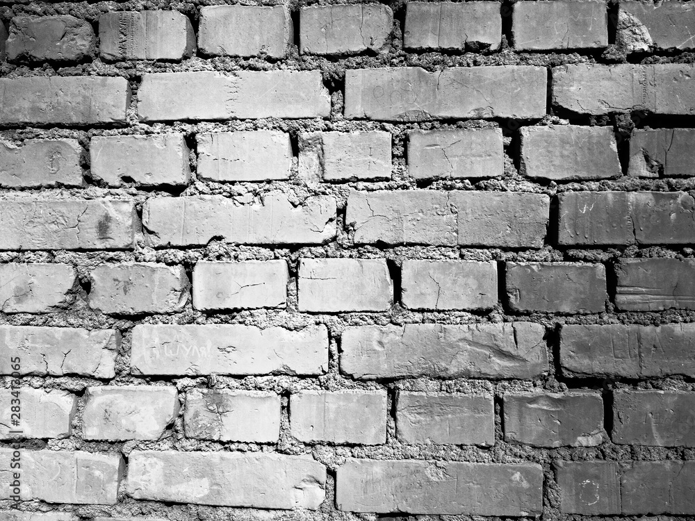 Black and white ruined brick wall photo background Black and white ruined brick wall photo background