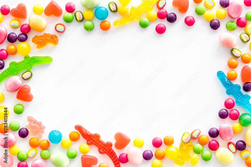 Candy dots and fruit jelly frame for blog design on white background top view mockup Candy dots and fruit jelly frame for blog design on white background top view mockup