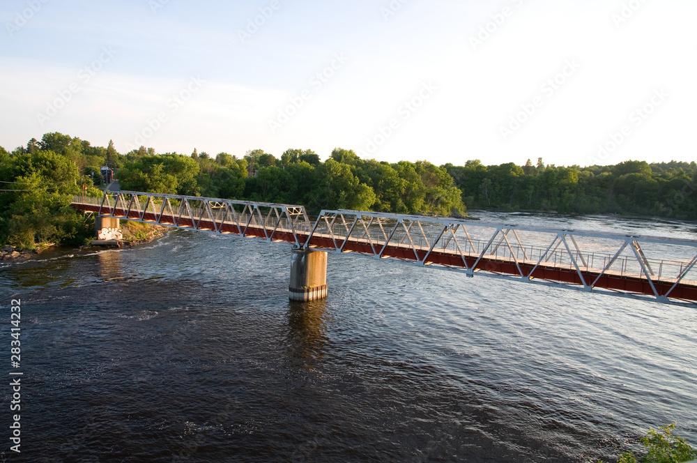 Red Pedestrian Bridge over a River in Gatineau Quebec