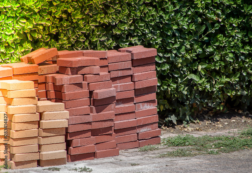 Stack of colored Interlocking pavers made from cement or concrete on a ...