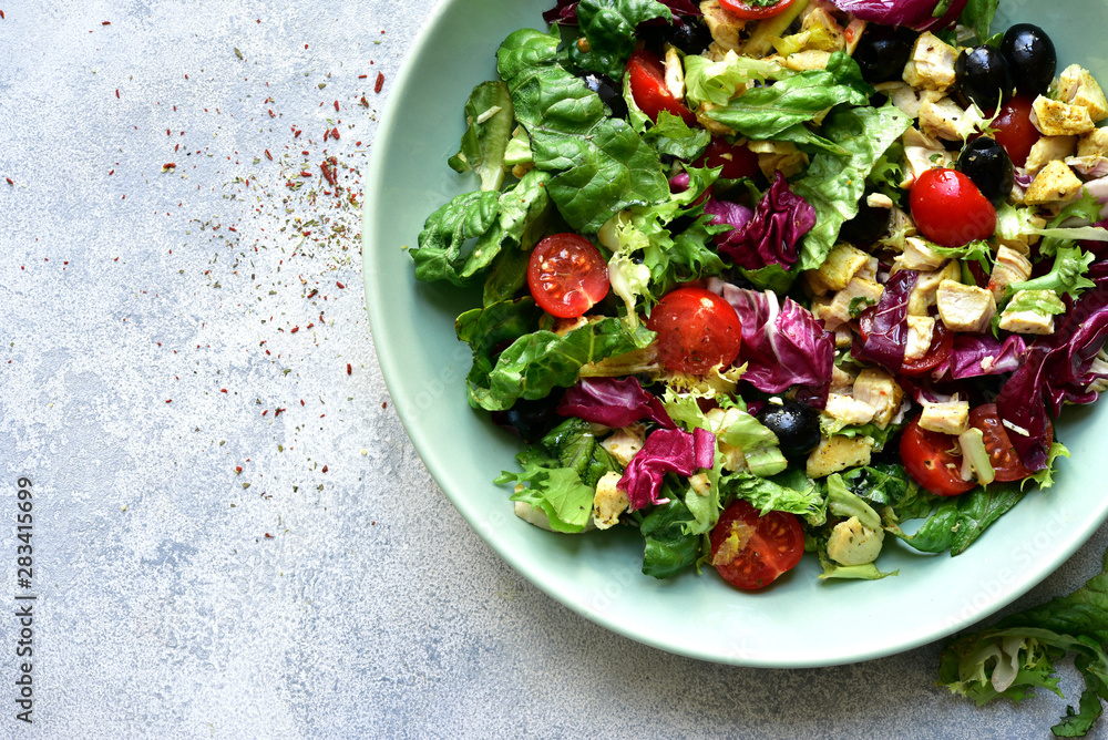 Vegetable salad with griklled chicken. Top view with copy space. Vegetable salad with griklled chicken. Top view with copy space.