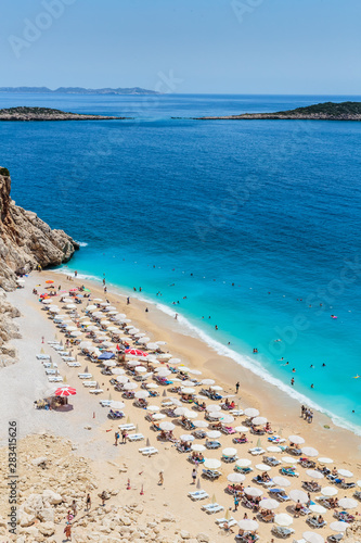 Fototapeta Naklejka Na Ścianę i Meble -  Aerial top view on the beach. Umbrellas, sand and sea waves