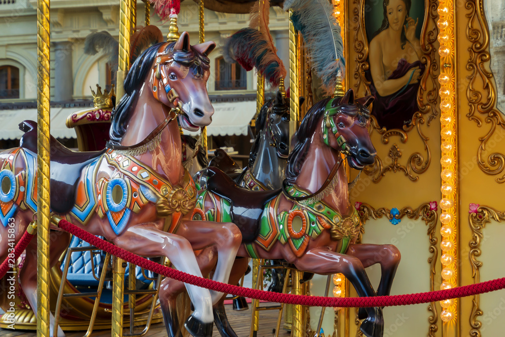 Beautiful vintage retro merry-go-round carousel wooden horses