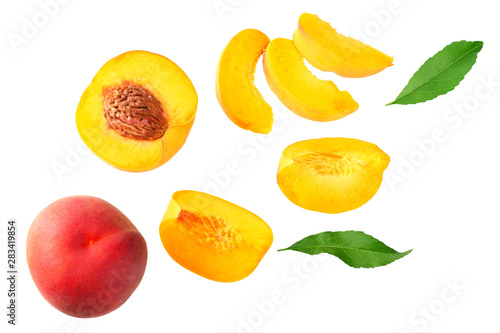 peach fruit with green leaf and slices isolated on white background. top view
