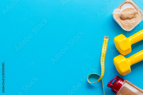 Wallpaper Mural Nutrition for workout with protein cocktail powder and bars on blue background top view mockup Torontodigital.ca