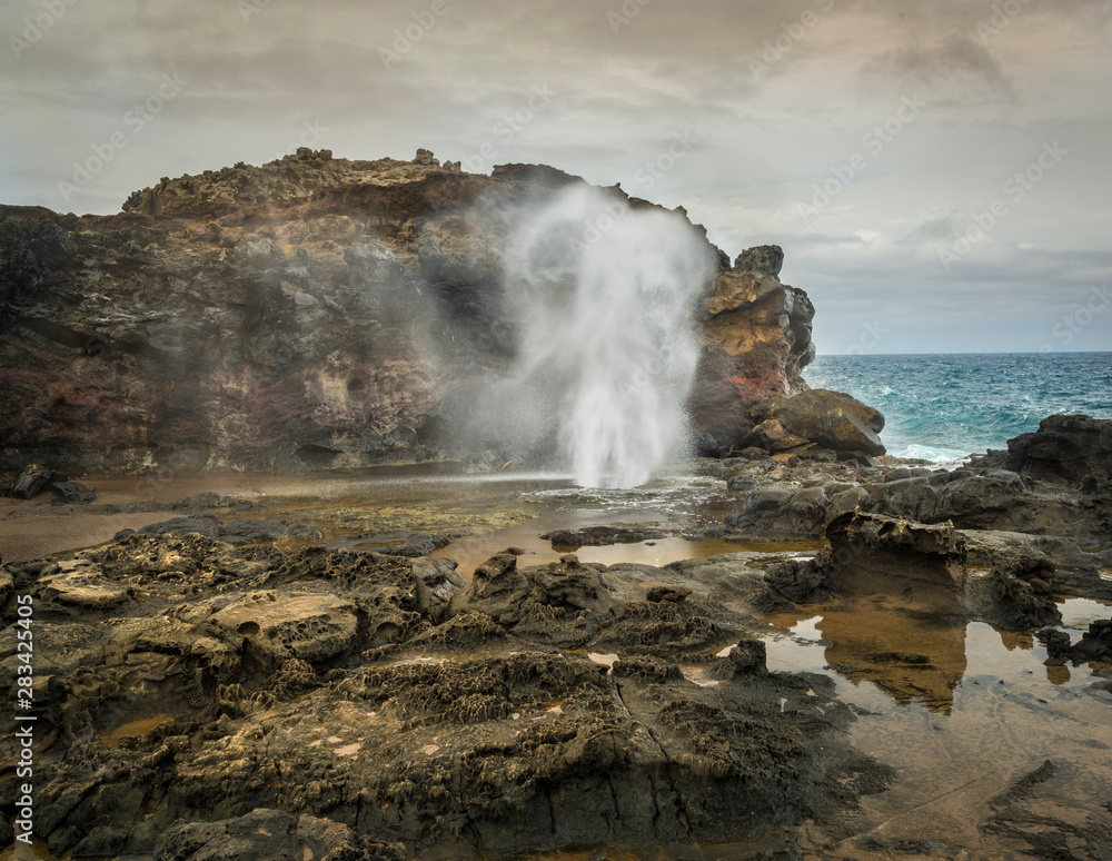 Sea water spouting from the Nakalele Blowhole on the northeast coast of Maui, Hawaii.