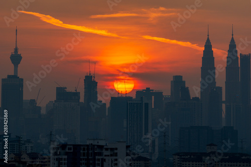 Photography KUALA LUMPUR, MALAYSIA - 11th AUGUST 2019; Cloudy and haze sunset view over down town Kuala Lumpur, Malaysia