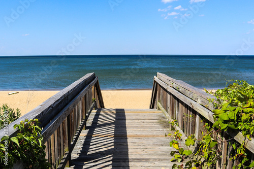 Walkway leading to Ocean View Beach in Norfolk, Virginia with the Chesapeake Bay in the background. photo