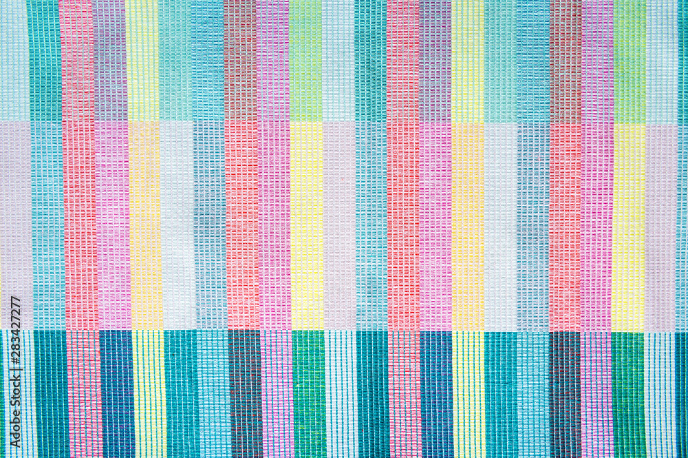 Colorful textile abstract background in a full frame close-up of woven layers - obrazy, fototapety, plakaty 