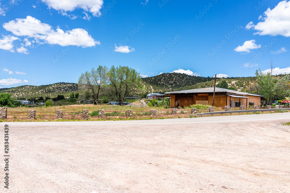 Las Trampas High Road to Taos village with historic vintage retro buildings houses on street in mountains Las Trampas High Road to Taos village with historic vintage retro buildings houses on street in mountains