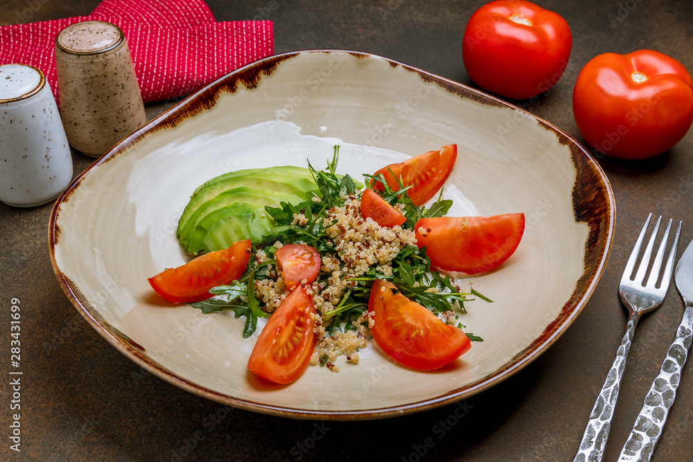 Quinoa side dish with onions and vegetables on wooden table Quinoa side dish with onions and vegetables on wooden table