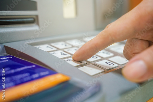 Wallpaper Mural Hand entering on pin pad of ATM pass code Torontodigital.ca