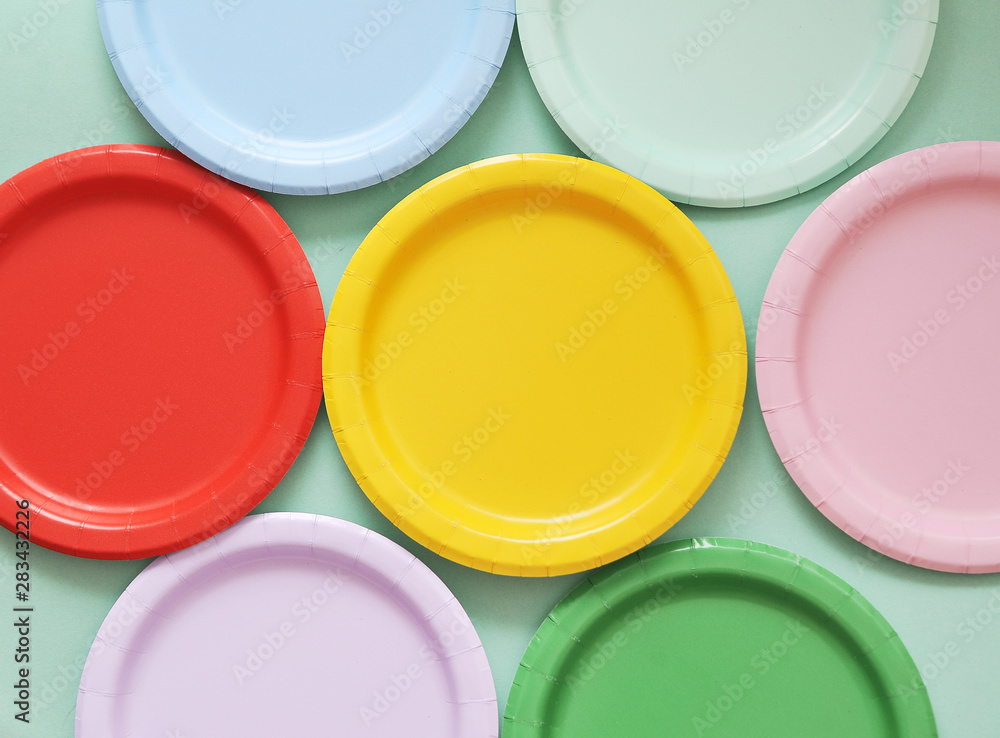 Colorful paper plates on light background. Colorful paper plates on light background.