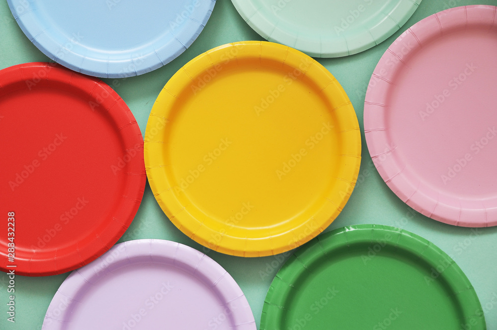 Colorful paper plates on light background. Colorful paper plates on light background.