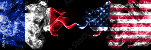 France vs United States of America, American smoky mystic flags placed side by side. Thick colored silky abstract smoke banner of French and United States of America, American photo