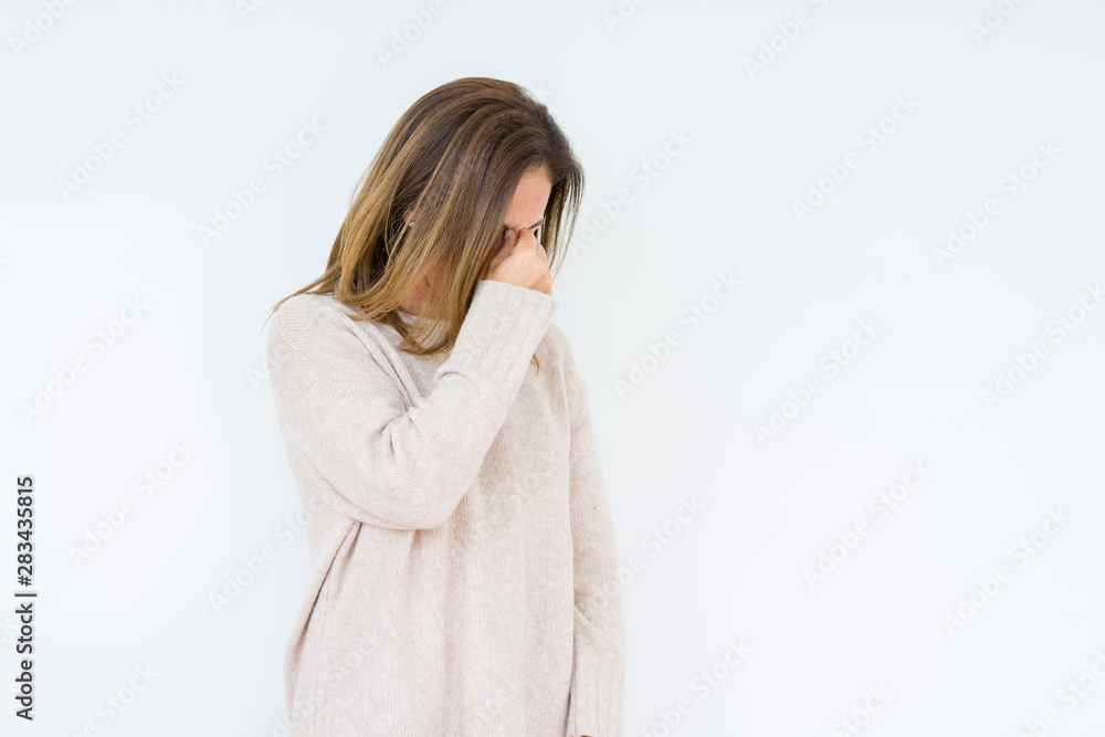 Beautiful middle age woman over isolated background tired rubbing nose and eyes feeling fatigue and headache. Stress and frustration concept. Beautiful middle age woman over isolated background tired rubbing nose and eyes feeling fatigue and headache. Stress and frustration concept.