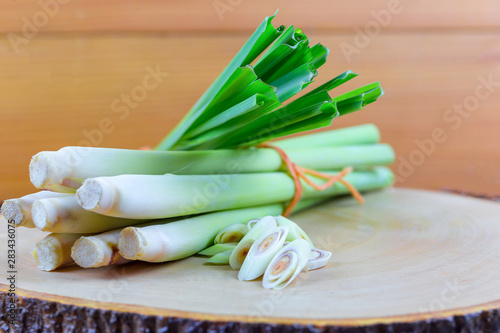 Photography Fresh lemongrass rope and lemongrass slice on wooden cutting board in cooking concept