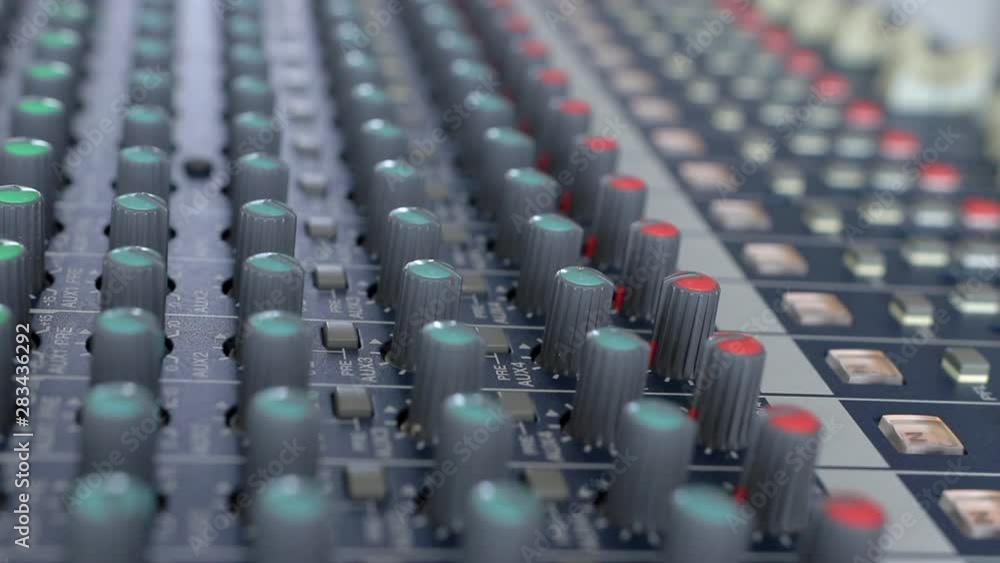 Man adjusting aound an Audio mixer, Working with sound mixing console. Man adjusting aound an Audio mixer, Working with sound mixing console.