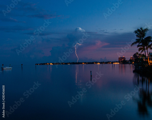 Lightning Strikes on a Sunset in Coconut Grove with Beautiful Pink and Blue Sky.   © colin