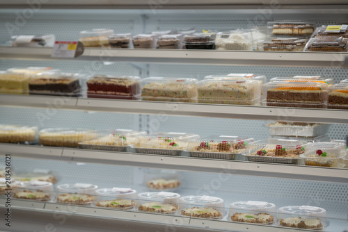Vászonkép Packaged cakes at the supermarket bakery open air freezer