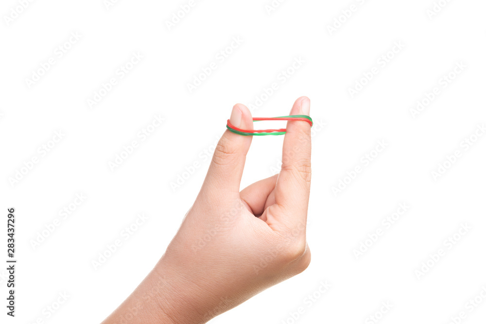Child hand playing with elastic rubber band isolated on white Child hand playing with elastic rubber band isolated on white