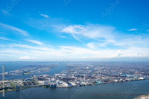 Panoramic view of Industrial zone in background with blue sky during summer, Tokyo, Japan