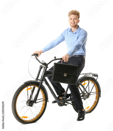 Young businessman riding bi...