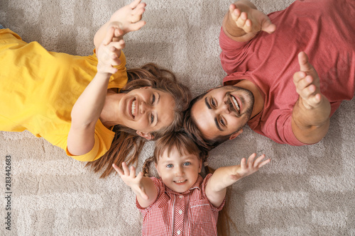 Portrait of happy young fam...