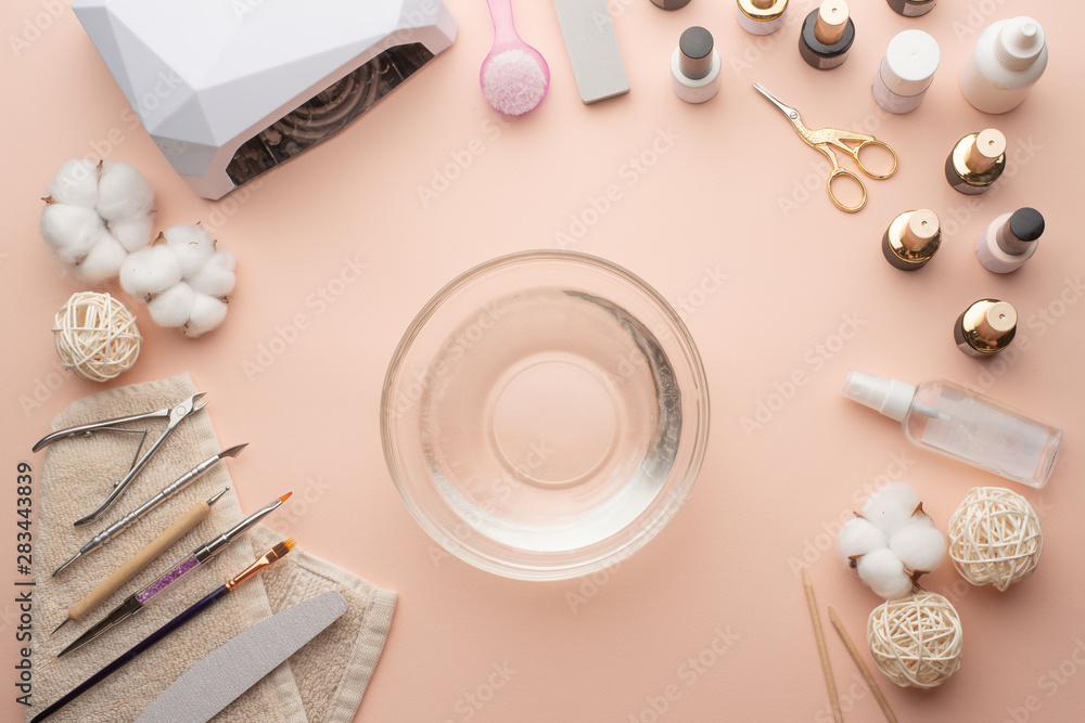 The concept of nail art. Woman gives herself a manicure on a white table, wow behind the nails, close-up. care for the nails The concept of nail art. Woman gives herself a manicure on a white table, wow behind the nails, close-up. care for the nails