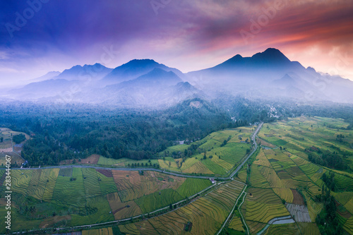 high mountain aerial photo where the red sky and sunrise are very beautiful and spoil the eyes above the rice fields in bengkulu, indonesia, asia