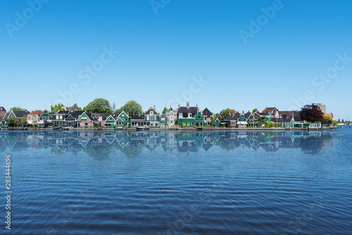 Rural houses with lake and clear sky in Netherlands 