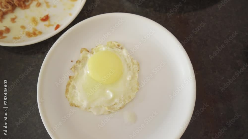 Tasty poached egg top down view shot, rotating shot, slow motion Tasty poached egg top down view shot, rotating shot, slow motion