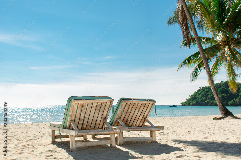 Two beach chairs on the tropical sand beach, Summer holiday and vacation concept for tourism. Inspirational tropical landscape