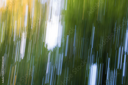 Abstract background, Autumn background, Reflection of autumn leaves in the water when moving in the form of colored lines.