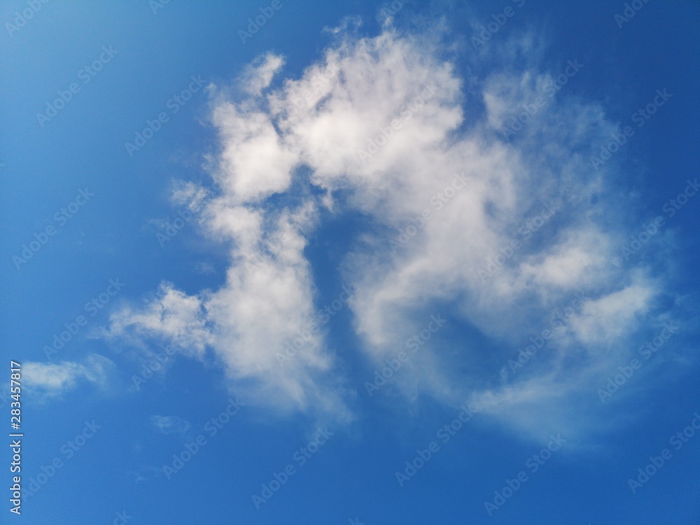 white strange clouds in the blue sky natural background beautiful nature environment space for write white strange clouds in the blue sky natural background beautiful nature environment space for write