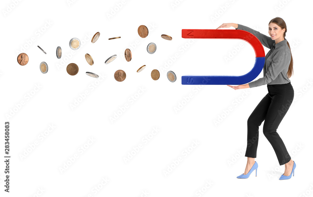 Young woman attracting money with magnet on white background Young woman attracting money with magnet on white background
