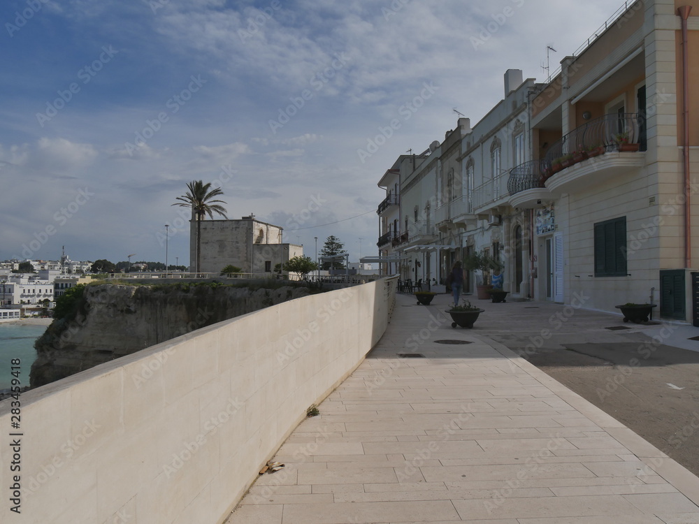 Otranto panorama of the beach and of the southern promenade. Otranto sandy beach and its white southern promenade are located on the Adriatic coast of Salento, Italy.