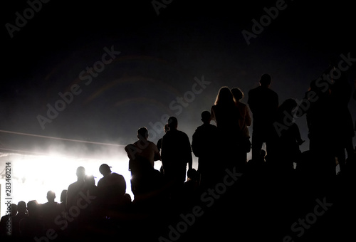 Silhouette of concert crowd and stage lights