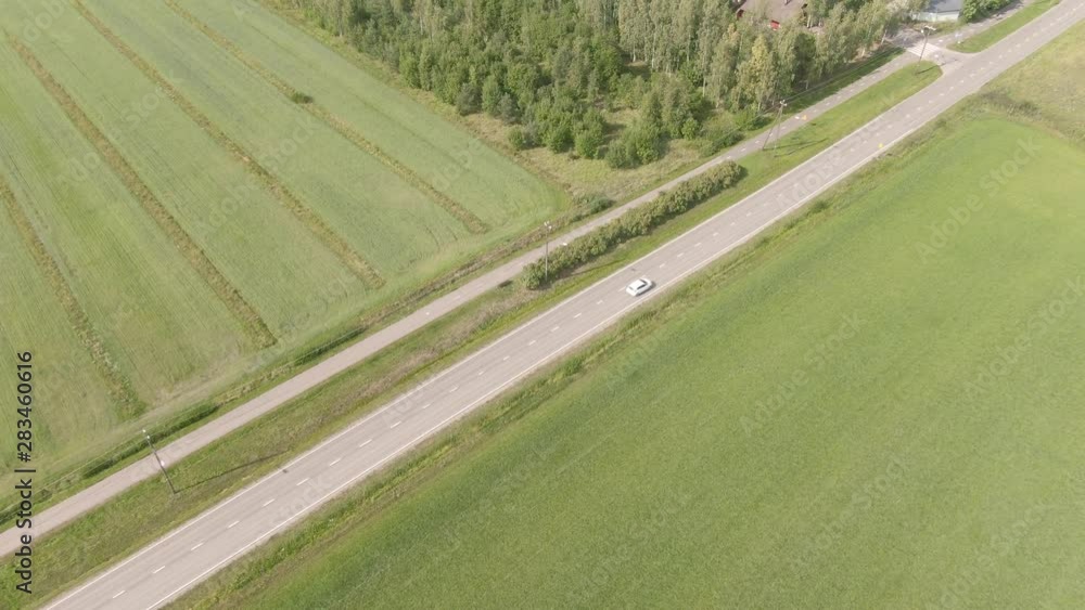 Cars driving with fast speed on asphalt road. View from top. Drone shot. Transport. Moving automobile. Cars driving with fast speed on asphalt road. View from top. Drone shot. Transport. Moving automobile.