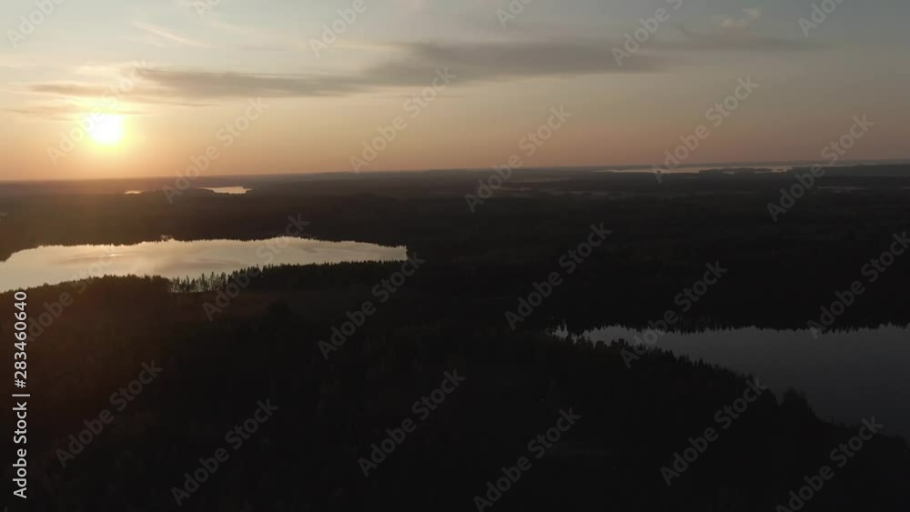 Sunset view. Drone shot of landscape with lake. Golden sky and horizon. Reflection in the water. Nature. Dark. Sunset view. Drone shot of landscape with lake. Golden sky and horizon. Reflection in the water. Nature. Dark.