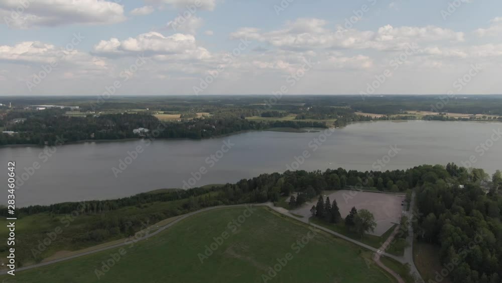 Flying over huge river. Forest, trees and pond. Wild nature. Water. Horizon. Arial drone shot. Flying over huge river. Forest, trees and pond. Wild nature. Water. Horizon. Arial drone shot.